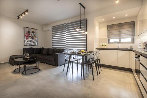 Ilisia Apartment | Black & White 2BR Apt steps from Mavili Square