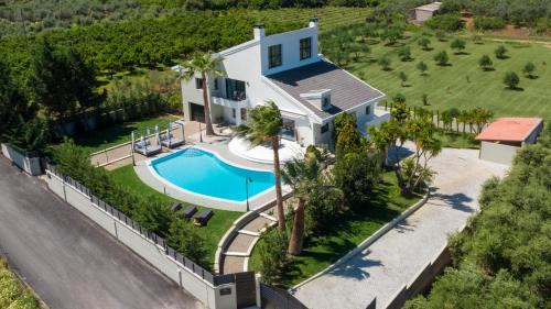Vamvakopoulo Villa | Gregorys Private Luxury Villa with Heated Pool & Gardens