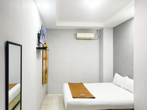 Waru House | Hotel Prisma Mitra RedDoorz