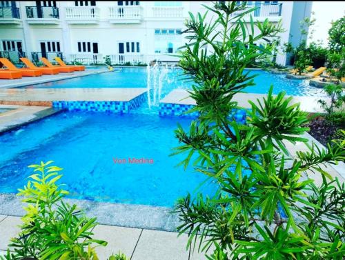 Mandurriao Apartment | Lafayette Park Square with balcony facing pool view
