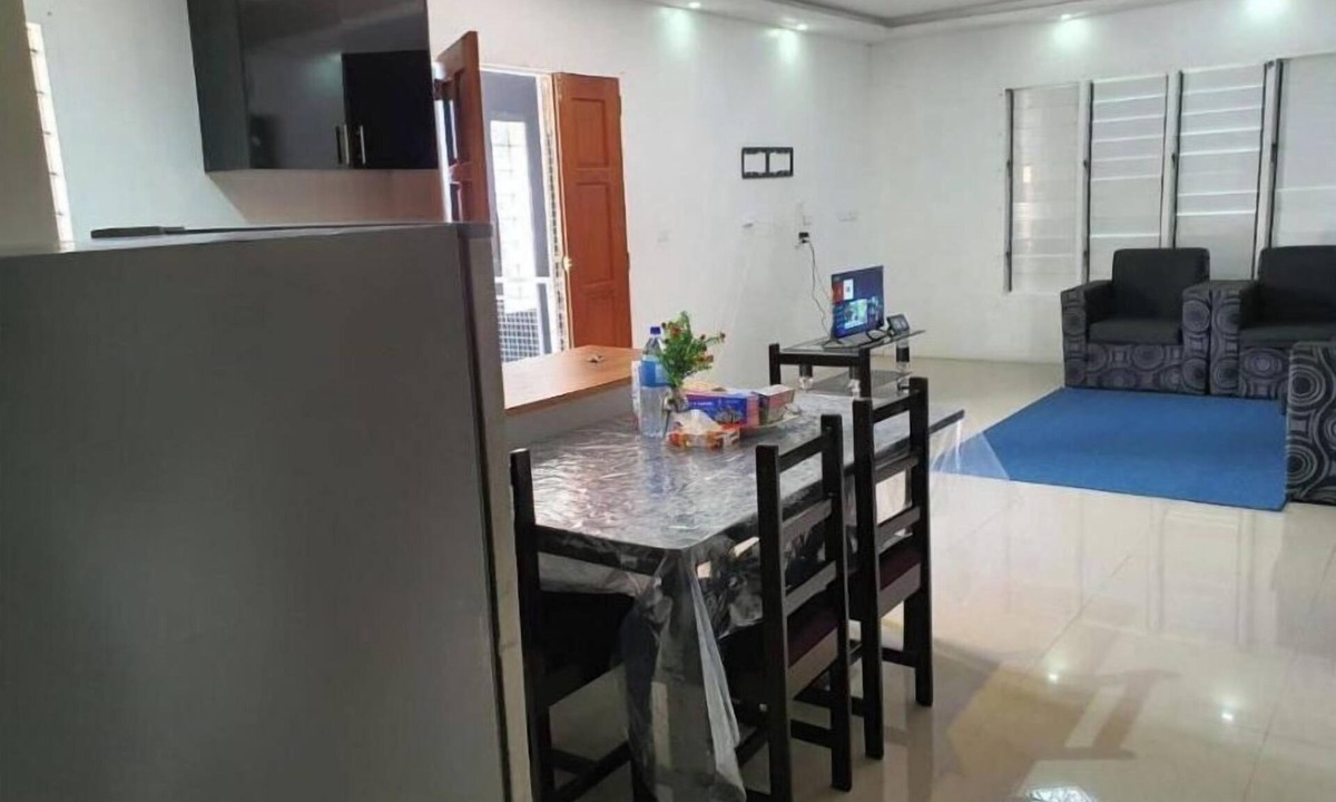 Suva Apartment | Master Bedroom with shared kitchen and living room