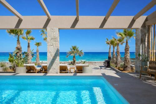 Agkisaras Villa | Sabbia Mare BeachFront Villa, steps from Dining & Shops, By ThinkVilla