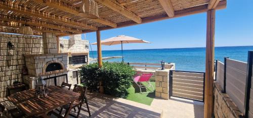 Mires Villa | Seafront Villa Cside w BBQ and private yard