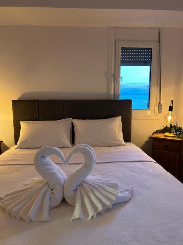 Saronida Apartment | Sunny Modern Beach Retreat Steps from the Shore
