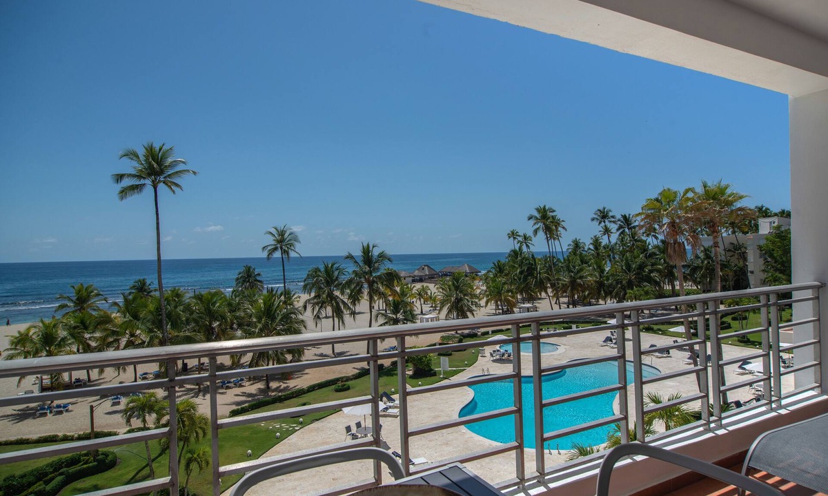 Juan Dolio Apartment | Trendy Beach Scene at a Harmony Beachfront Condo in Costa del Sol