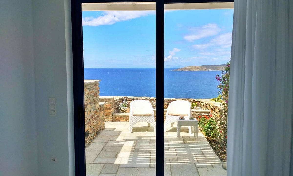 Tinos Town House | Windmill and houses by the sea // Stavros Bay