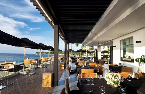 El Batey Apartment | 1BD beachfront condo in gated luxury residence, gym/pool, near everything