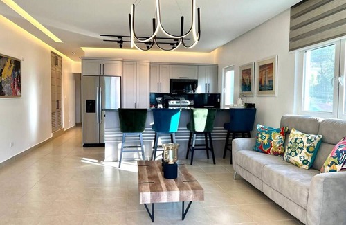 El Batey Apartment | 2BD sea-views condo, guest-friendly, steps from sandy beach and clubs