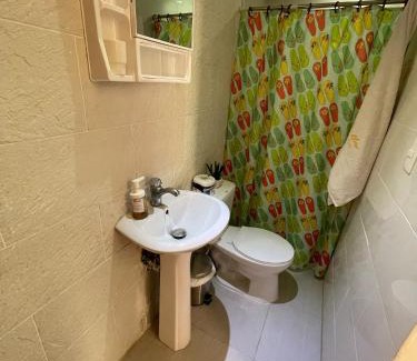 El Batey House | Central Area Bedroom With Common Kitchen, living room