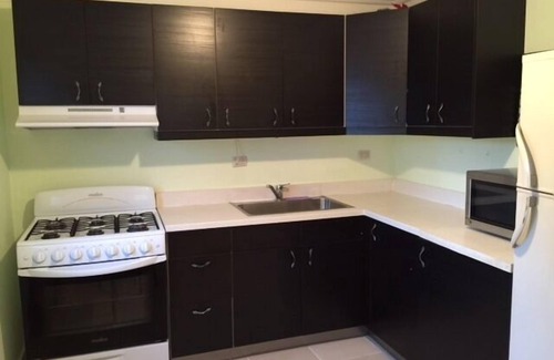 El Batey Apartment | Guest-Friendly 2-bedroom top-floor condo with pool in the center of Sosua