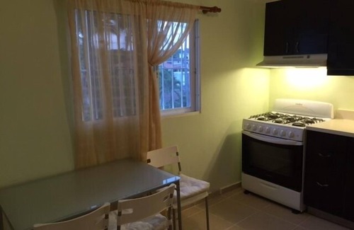 El Batey Apartment | Guest-Friendly 2-bedroom top-floor condo with pool in the center of Sosua
