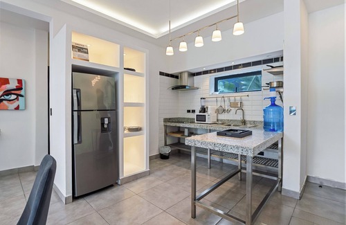 El Batey Apartment | Modern 1BR at Rizz Suites Pool Access Walk to Beach King Bed Strong AC