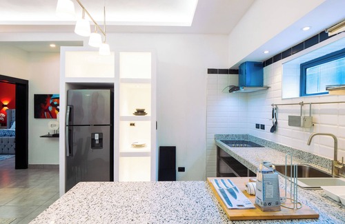 El Batey Apartment | Modern 1BR at Rizz Suites Pool Access Walk to Beach King Bed Strong AC