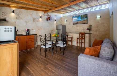 El Batey House | Room in Guest Room - Central Area Bedroom With Common Kitchen, Living Room