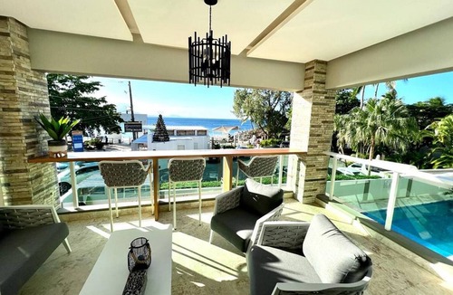 El Batey Apartment | 2BD sea-views condo, guest-friendly, steps from sandy beach and clubs