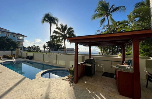 El Batey Apartment | 2BD sea-views condo, guest-friendly, steps from sandy beach and clubs
