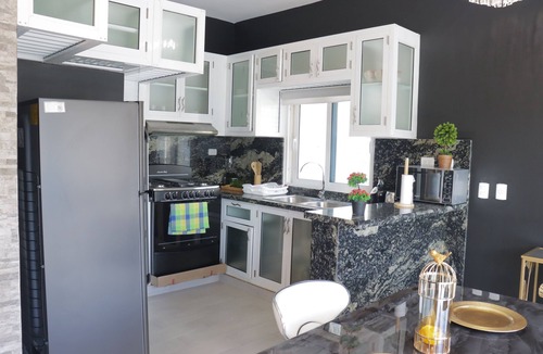 Urbanizacion Tavarez Villa | A modern 2-bedroom villa with pool and lounge area