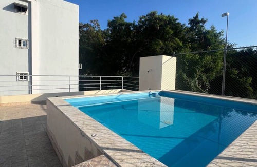 Santo Domingo Oeste Apartment | Charming 3-bedroom apartment with WiFi, AC and a picuzzy in Santo Domingo Oeste.