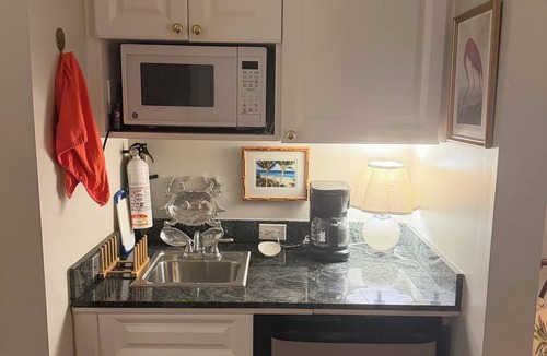 Dunmore Town Condo | Charming Suite with updated Living Room, king bed, WiFi, and a Fresh Water Pool.
