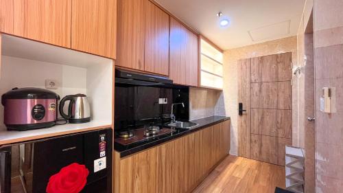 Tetebatu Apartment | Comfortable and Nice Studio Apartment at Delft Ciputra Makassar By Travelio