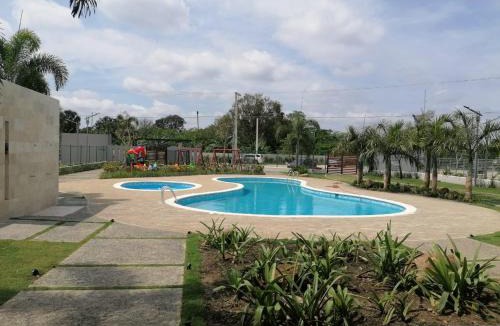 Llanos de Gurabo I Apartment | Confortable apartamento de 3 tres habitaciones, con hermosa vista de area verde, ademas de piscinas y juegos infantiles en area recreativa