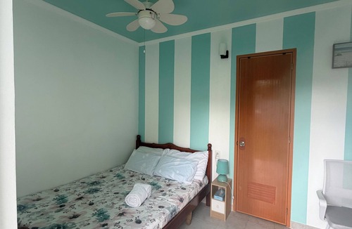 San Remigio Bed & Breakfast | Couples Getaway with A.C./WiFi/Karaoke and complimentary water & coffee