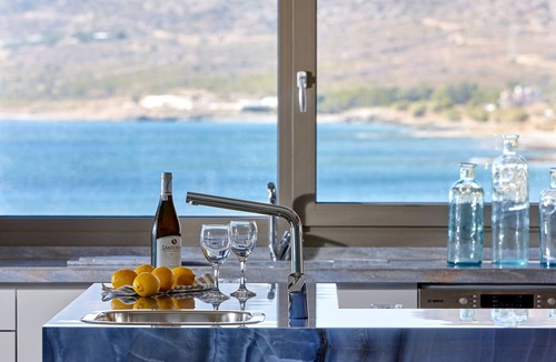 Koutsouras Condo | Exclusive beachfront penthouse retreat with private hot tub