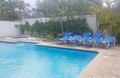 El Batey Apartment | Guest-friendly beachfront 3BD 3BTH apt, sea views, pool, near shops/restaurants