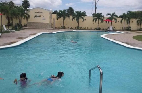 Gregorio Luperon Apartment | Luxury condo with pool gym parking wifi and more