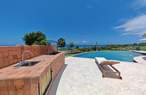 La Cienaga Villa | Luxury Oceanfront Villa with Heated Pool, Jacuzzi, AC, BBQ, Starlink Wi-Fi, Chef's Kitchen, Staff Included, Mountain Views, Near El Quemaito, San Rafael, and Los Patos Beach
