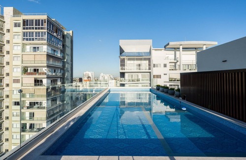 Serralles Condo | LuxuryCityCenterApart-Pool-Gym-WiFi-A/C-YellowKey*