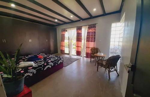 Pacific Harbour Villa | Master bedroom, Large bed, parking