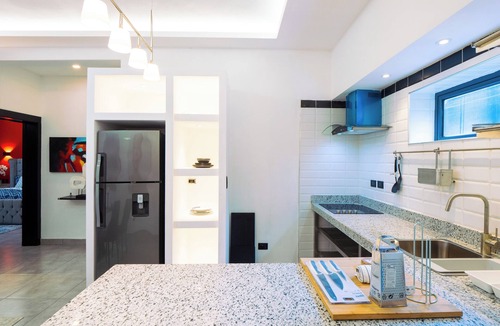 El Batey Apartment | Modern 1BR at Rizz Suites Pool Access Walk to Beach King Bed Strong AC