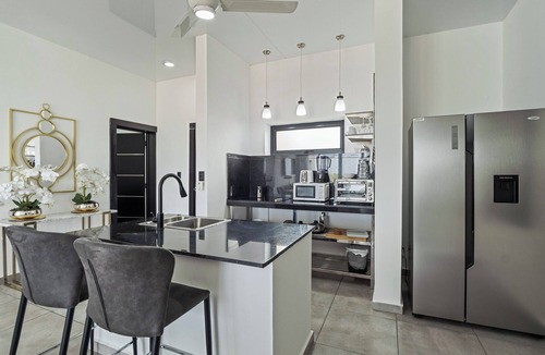 El Batey Apartment | Modern 2BR at Rizz Suites Pool Access Walk to Beach 2 King Beds Sosua