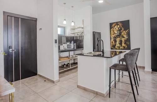 El Batey Apartment | Modern 2BR at Rizz Suites Pool Access Walk to Beach 2 King Beds Sosua