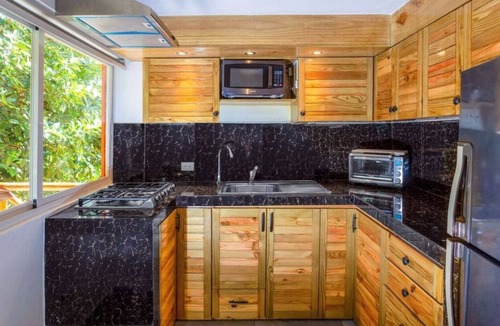 Puerto Bahia Apartment | Modern jungle studio with jacuzzi near quiet beach