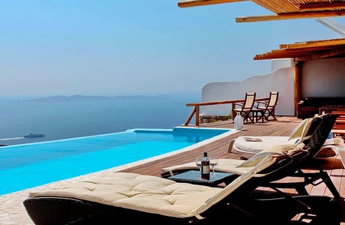 Faros Armenistis Villa | My Rental Homes - Queen Villa with pool area furnished with sunbeds and sea view