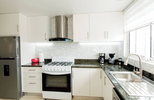 El Cortecito Apartment | Pristine Beach with Crystal-clear water for your getaway. 4BR, Pool, Rooftop.