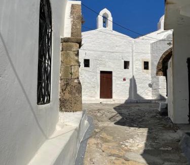 Skyros Town House | Red Windows to Blue Sky