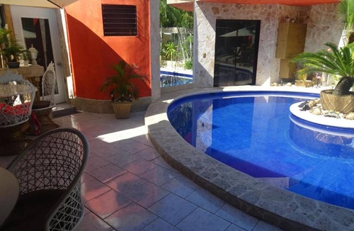 Playa Chiquita Apartment | Room + yummy breakfast, steps from casino/beach, guest-friendly, pool/TV/WiFi