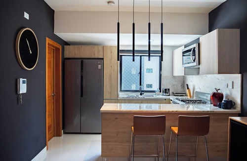 Ensanche Quisqueya Apartment | Spacious 3-bedroom apartment with AC in peaceful Santo Domingo, Pool and Gym