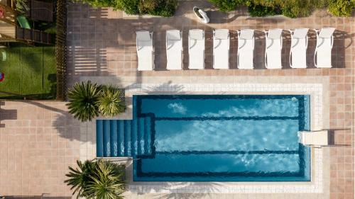 Houdetsi Villa | Tsourlakis Residence, A Tranquil Family Oasis with Pool, By ThinkVilla