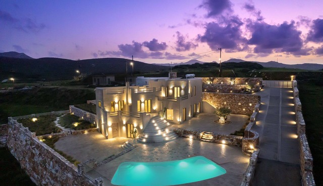 A private sanctuary above the Aegean . Sunlight, stillness, and the olive grove