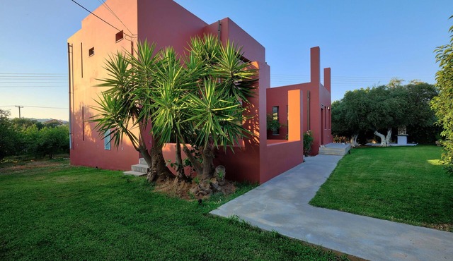 Bright villa surrounded by orange trees