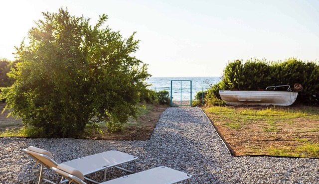 Charming Beachfront Haven, Steps from the Beach