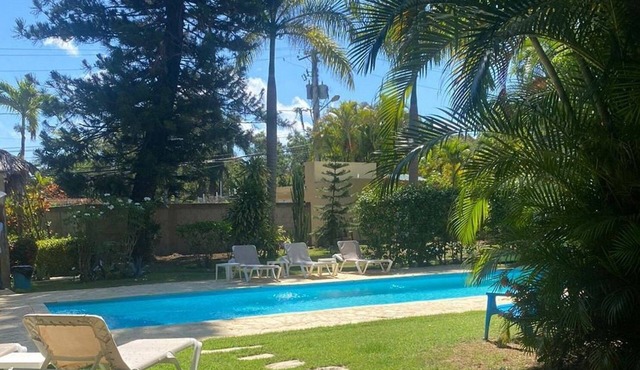 Guest-friendly bungalow with pool in tropical garden, near all