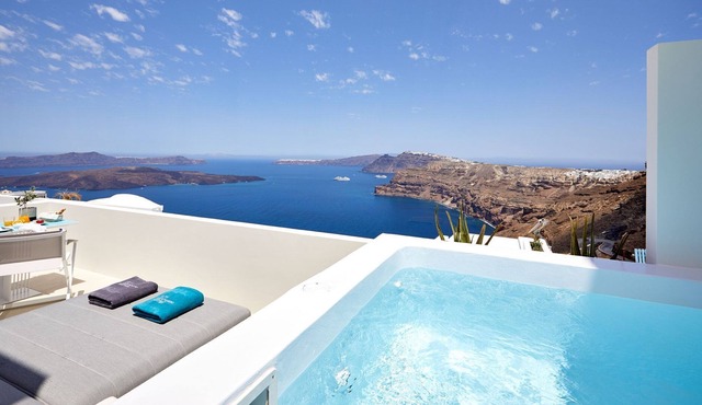 R 321 Rubi Suite Santorini patio, with exterior Jacuzzi mini pool, overlooking view of Caldera Incl