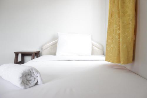 Spacious 2BR Apartment at Pinewood near JATOS By Travelio
