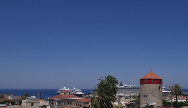 The windmill of the medieval city of Rhodes, Welcome at this unique place.