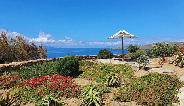 Windmill and houses by the sea // Stavros Bay